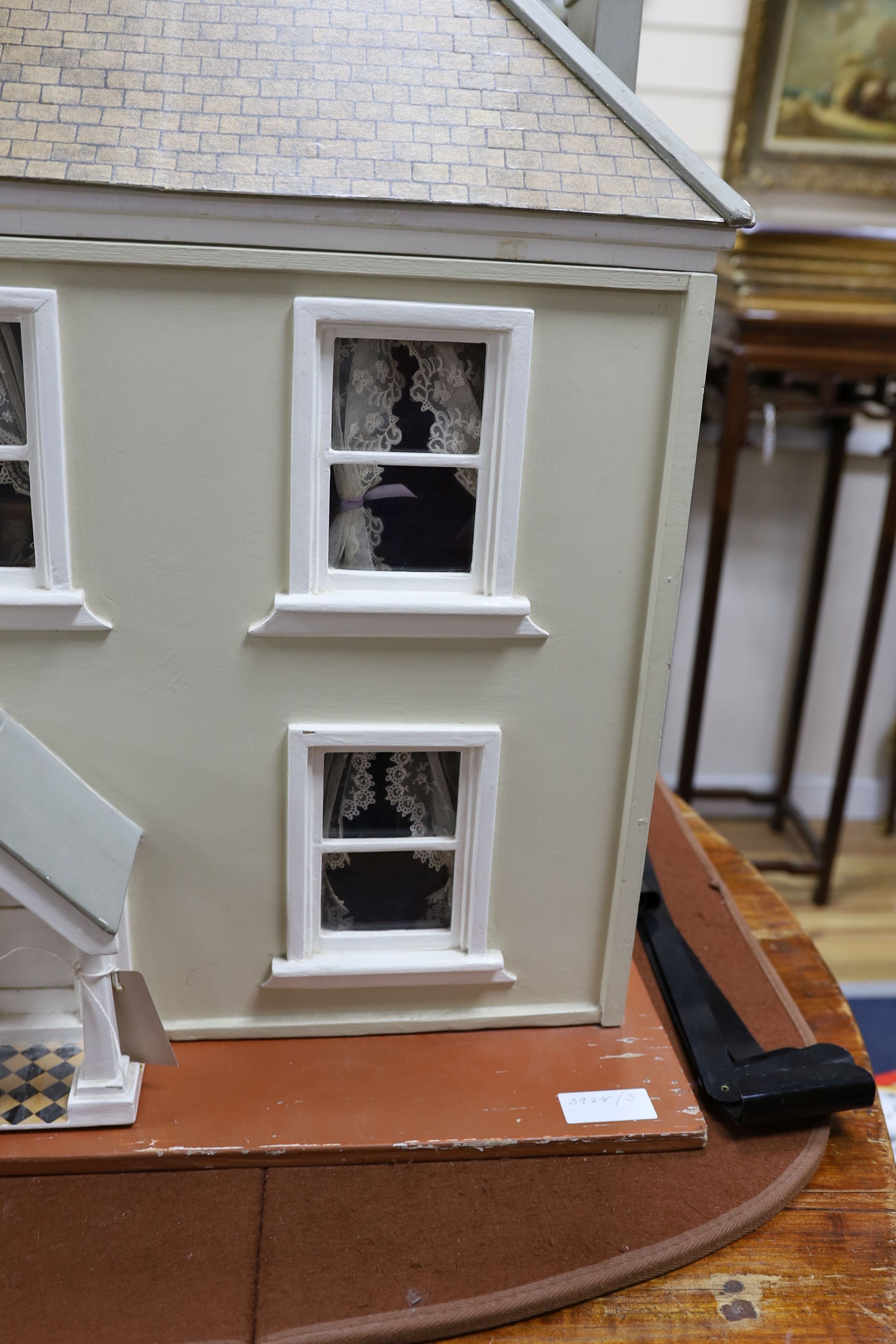 A dolls house, length 74cm, depth 39cm, height 66cm